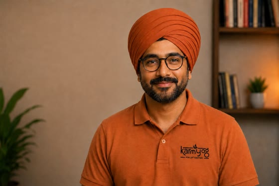 Vivek Acharya, the AI finance mentor, in an orange turban and KarmYog polo